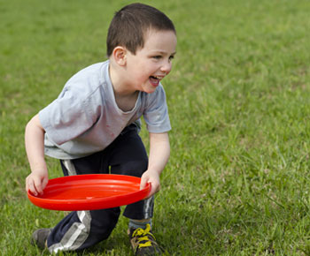 bigstock-Child-Playing-With-Frisbee