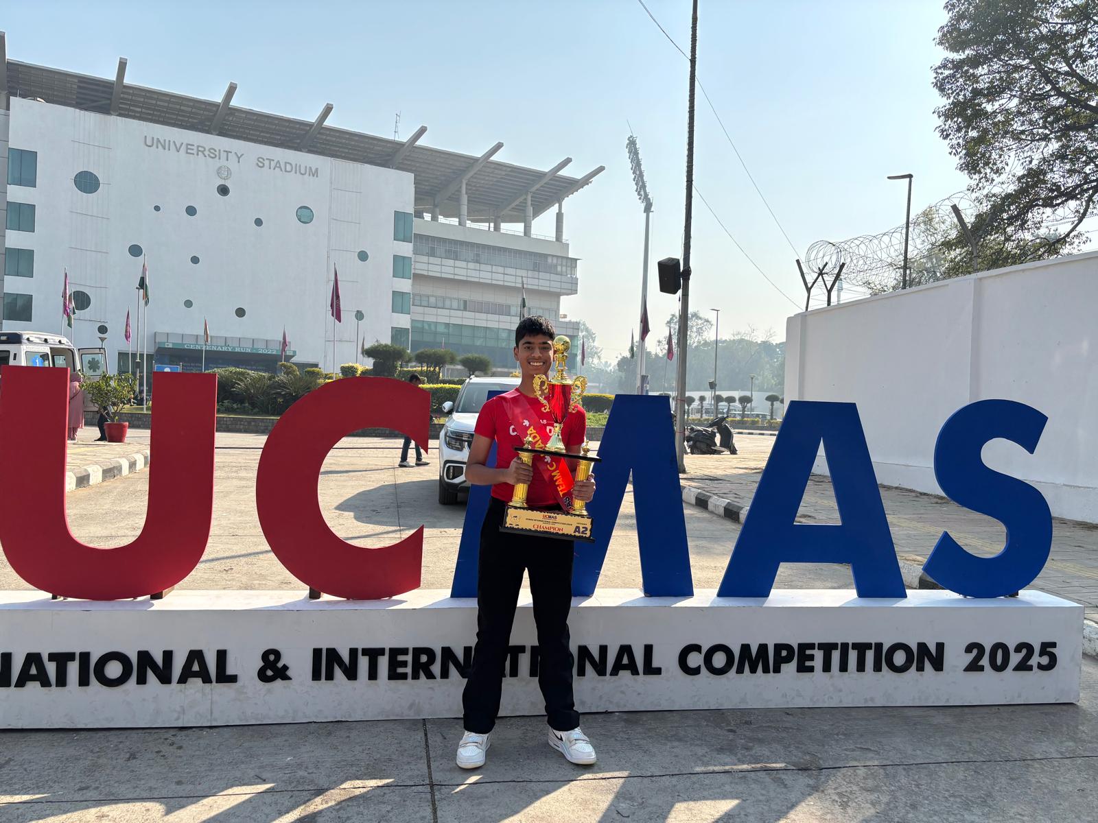 UCMAS Student with Trophy