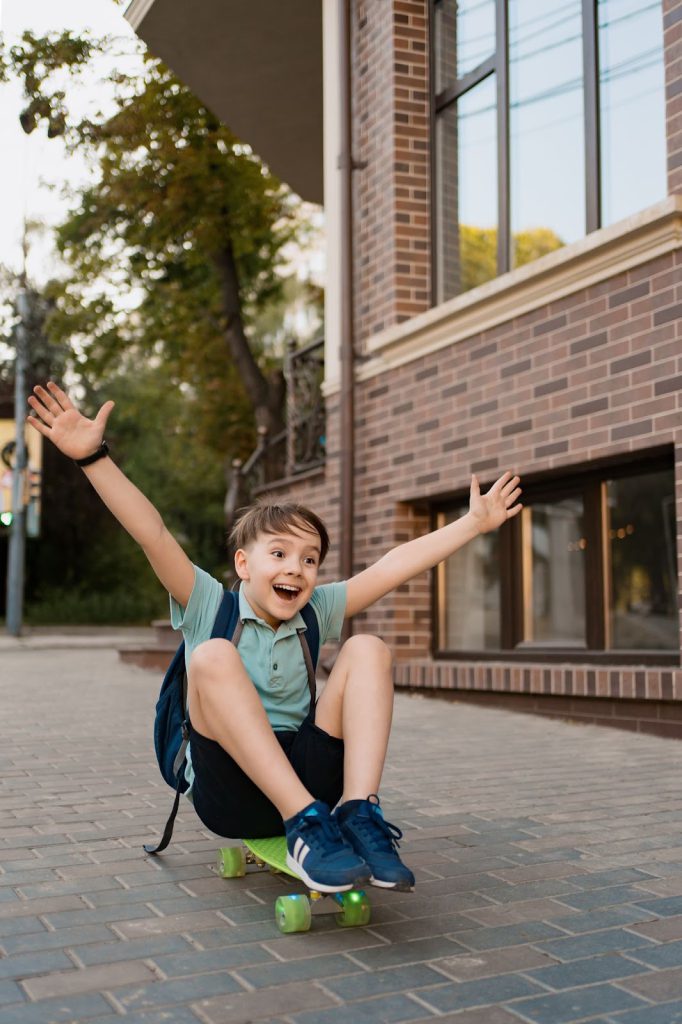 Happy kid with school bag going home